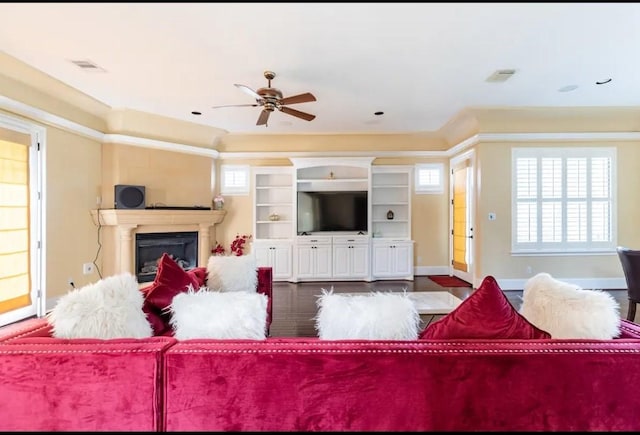 living room with ceiling fan and dark hardwood / wood-style floors