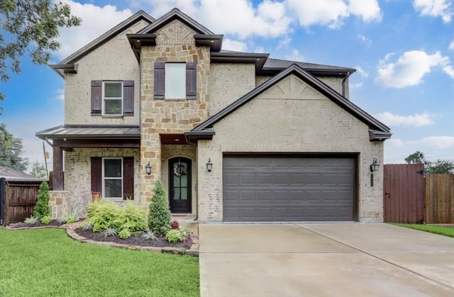 view of front of home featuring a garage and a front yard