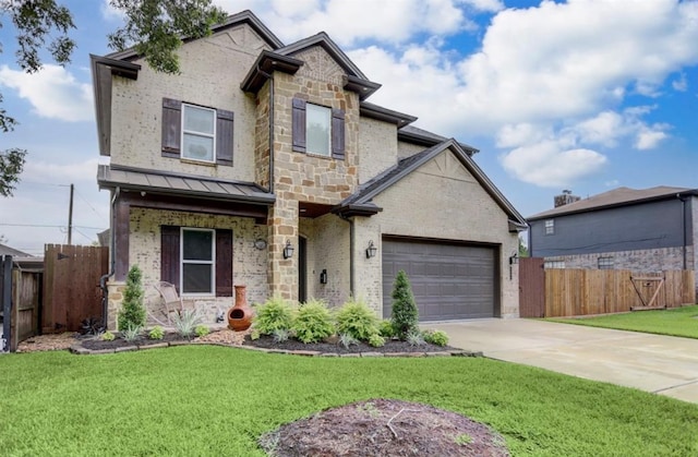 view of front of house featuring a garage and a front lawn