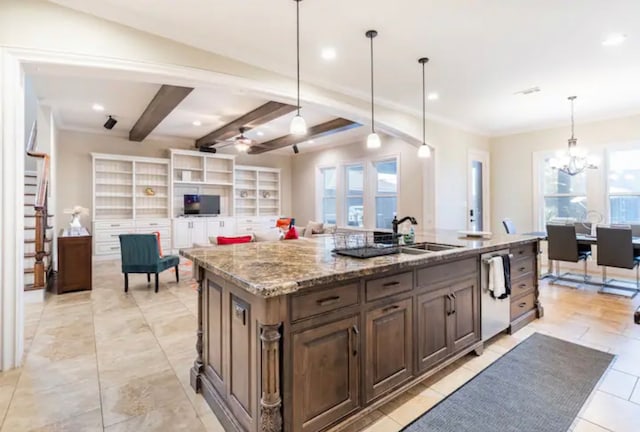 kitchen with hanging light fixtures, a kitchen island with sink, beamed ceiling, sink, and light tile floors