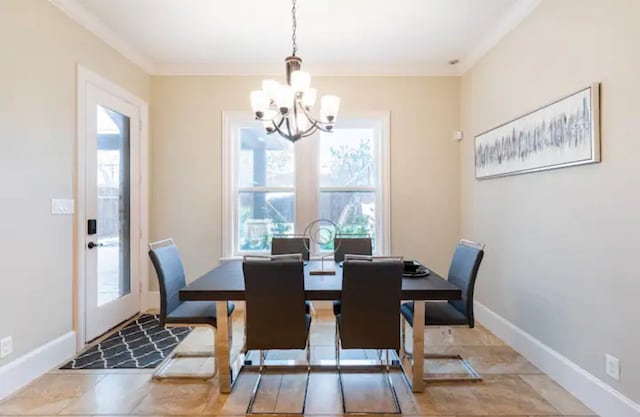 tiled dining area with a notable chandelier and crown molding