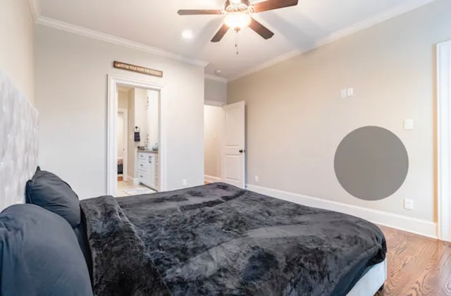 bedroom featuring wood-type flooring, ensuite bathroom, ceiling fan, and crown molding