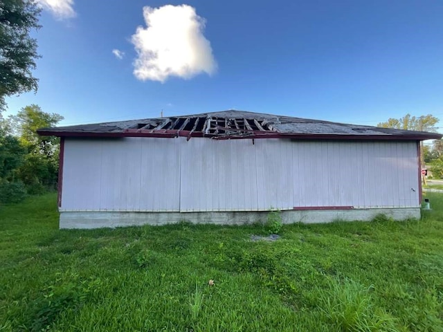 view of property exterior with a lawn