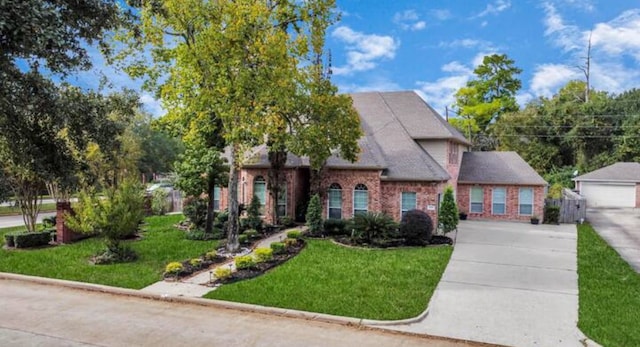 view of front facade with a front lawn and a garage