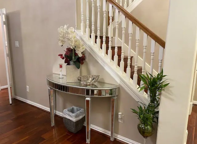 staircase with wood-type flooring