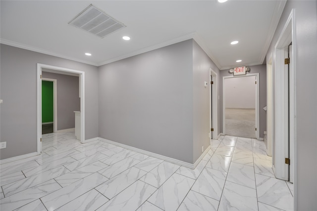 hall featuring ornamental molding and light tile floors