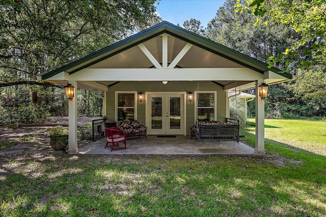 exterior space featuring a patio, french doors, and a lawn