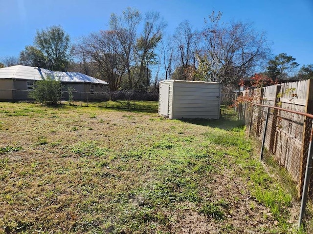 9690 Mapes St, Beaumont, TX 77707 - view of yard with a storage unit