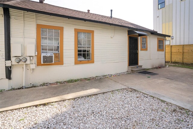 back of property with a patio