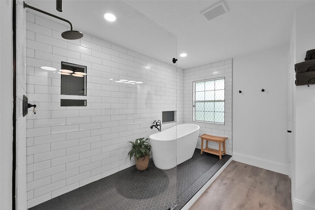 bathroom with wood-type flooring and separate shower and tub