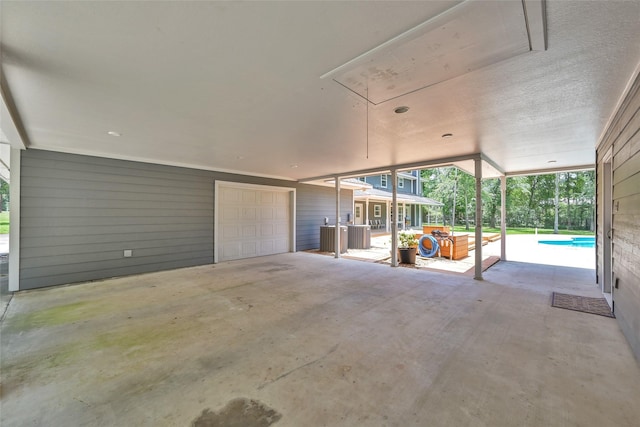 view of patio / terrace featuring a garage