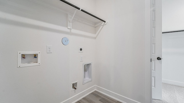 laundry room with hookup for a gas dryer, hookup for an electric dryer, hardwood / wood-style floors, and washer hookup