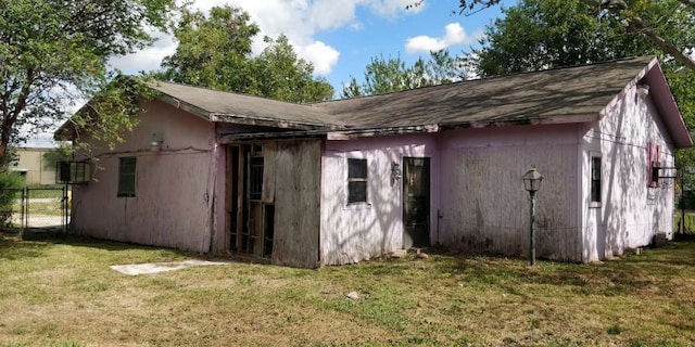 view of outdoor structure with a lawn