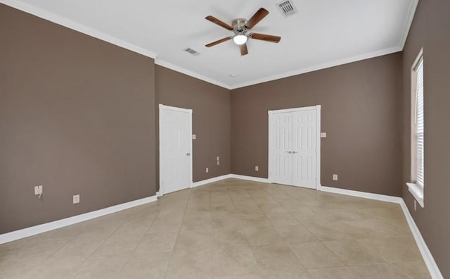 unfurnished room featuring a healthy amount of sunlight, ceiling fan, and crown molding