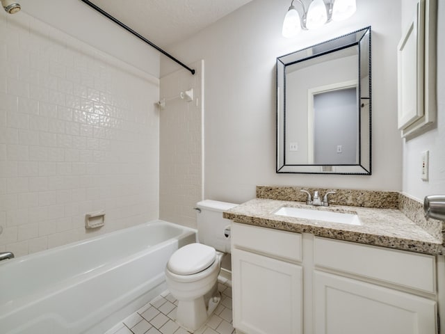 full bathroom with vanity, tiled shower / bath combo, tile patterned flooring, a textured ceiling, and toilet