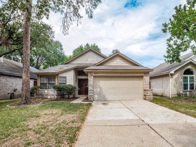 ranch-style house featuring a garage and a front lawn