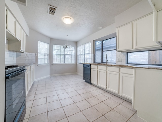 kitchen with tasteful backsplash, white cabinets, black appliances, and decorative light fixtures