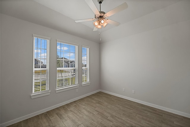 empty room featuring ceiling fan and hardwood / wood-style floors