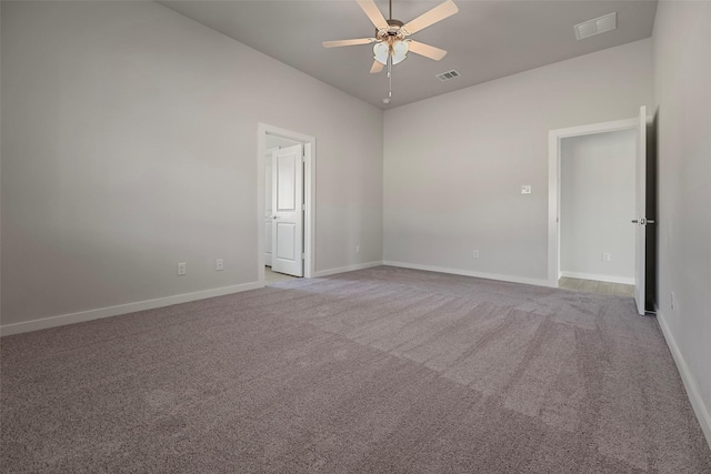 carpeted empty room featuring ceiling fan