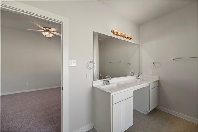 bathroom with ceiling fan and vanity