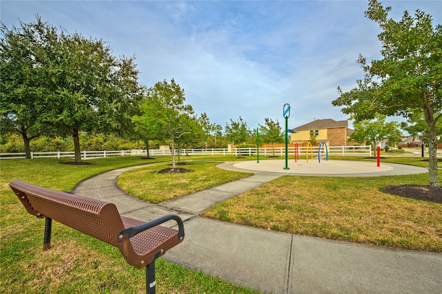 view of home's community with a yard