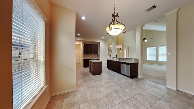 kitchen featuring dark brown cabinetry, ceiling fan, sink, stainless steel dishwasher, and decorative backsplash