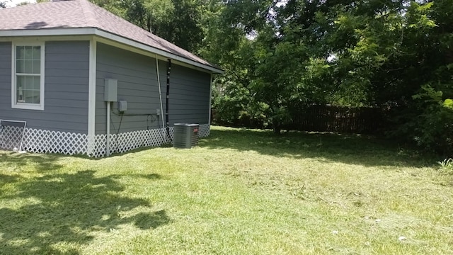 view of yard with central air condition unit