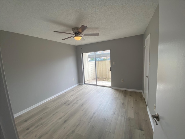 unfurnished room featuring ceiling fan, a textured ceiling, and light hardwood / wood-style flooring