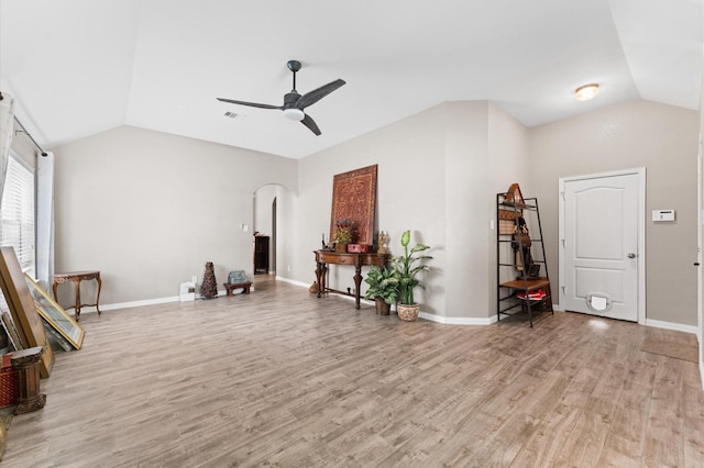 unfurnished room featuring ceiling fan, light hardwood / wood-style floors, and vaulted ceiling