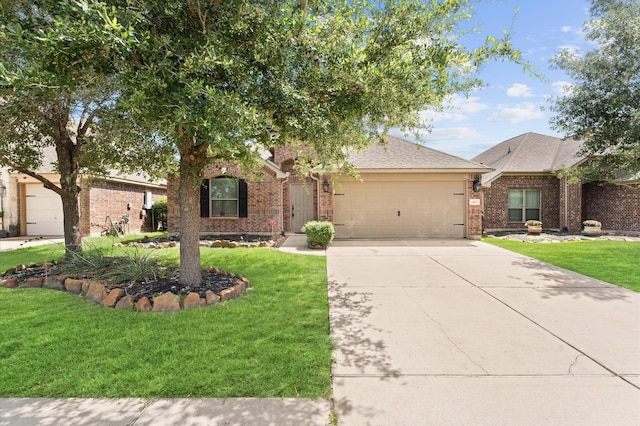 view of front facade with a garage and a front lawn