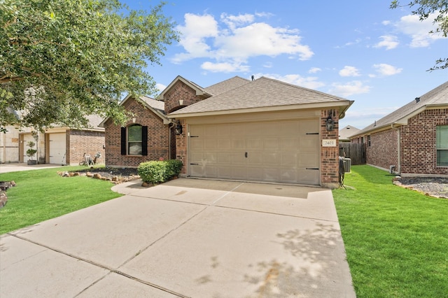 single story home featuring a garage and a front yard