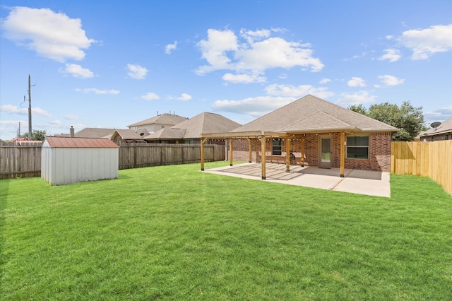 back of house featuring a storage unit, a patio area, and a lawn