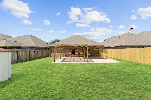 rear view of property with a patio area and a lawn