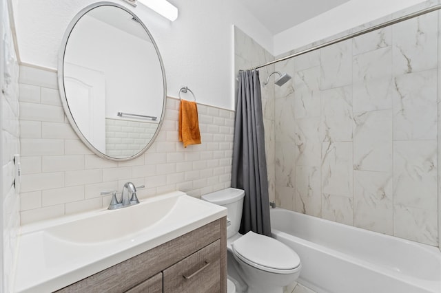 full bathroom with vanity, toilet, tile walls, and shower / bath combo with shower curtain