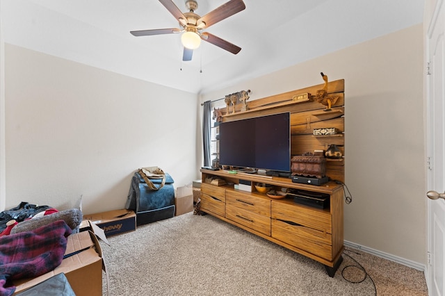 carpeted living room with ceiling fan