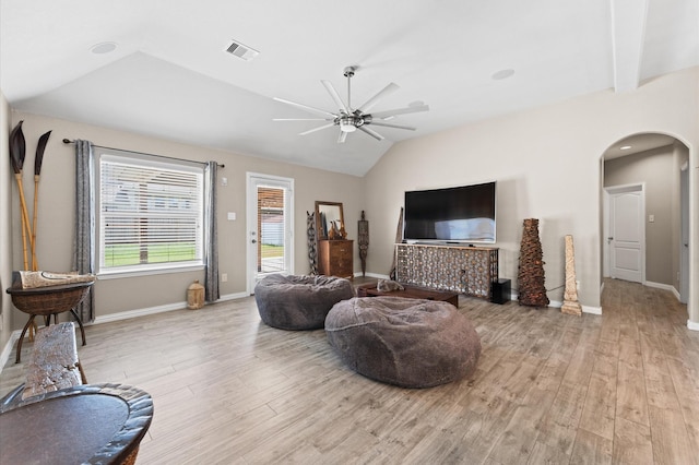 living room with light hardwood / wood-style flooring, ceiling fan, and lofted ceiling