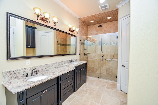 bathroom with vanity, ornamental molding, and walk in shower