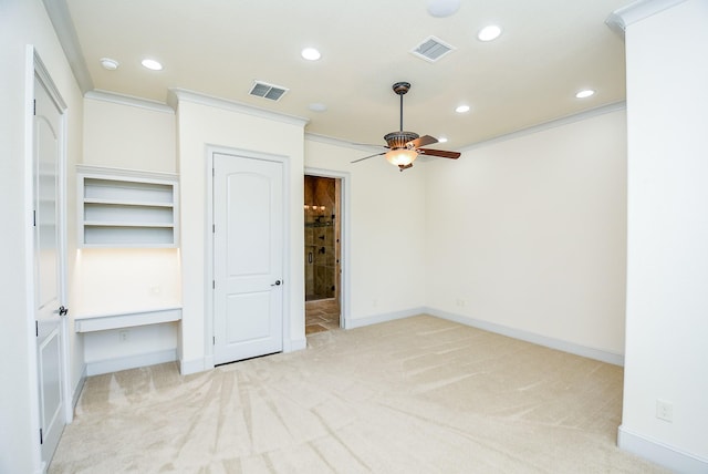 unfurnished bedroom with light carpet, ceiling fan, and ornamental molding