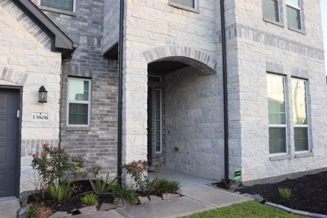 view of exterior entry with a garage