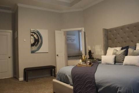 bedroom with carpet flooring and ornamental molding