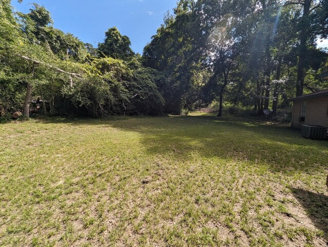 view of yard with central AC