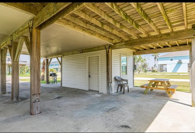 23171 Buena, Galveston, TX 77555 - view of patio / terrace featuring a carport