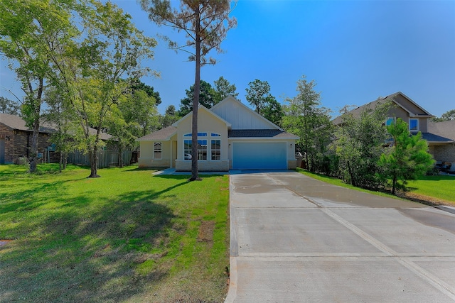 single story home featuring a front yard and a garage