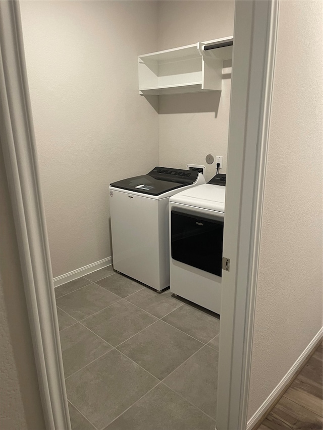 laundry room featuring independent washer and dryer and tile flooring