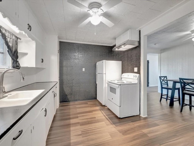 kitchen featuring sink, white appliances, light wood-type flooring, ceiling fan, and white cabinets