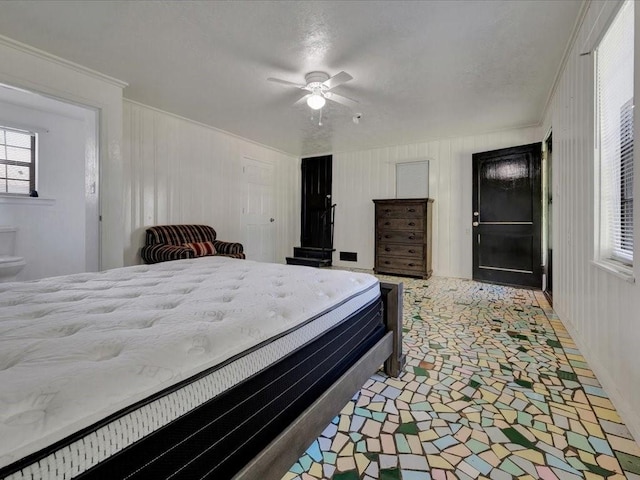 bedroom featuring ceiling fan and ornamental molding