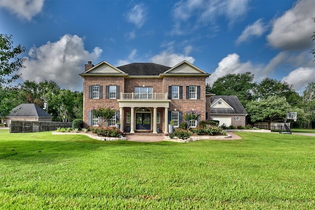 view of front of house with a front yard and covered porch