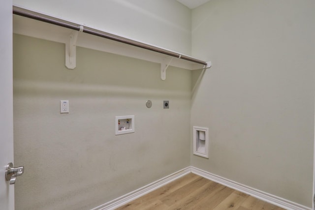 clothes washing area with washer hookup, hardwood / wood-style flooring, hookup for a gas dryer, and hookup for an electric dryer