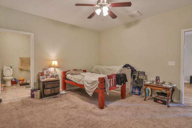 bedroom featuring ceiling fan and light carpet