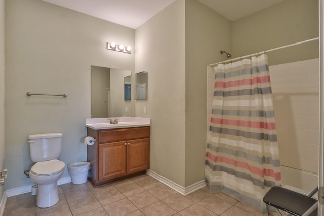 bathroom featuring a shower with curtain, toilet, tile patterned floors, and vanity